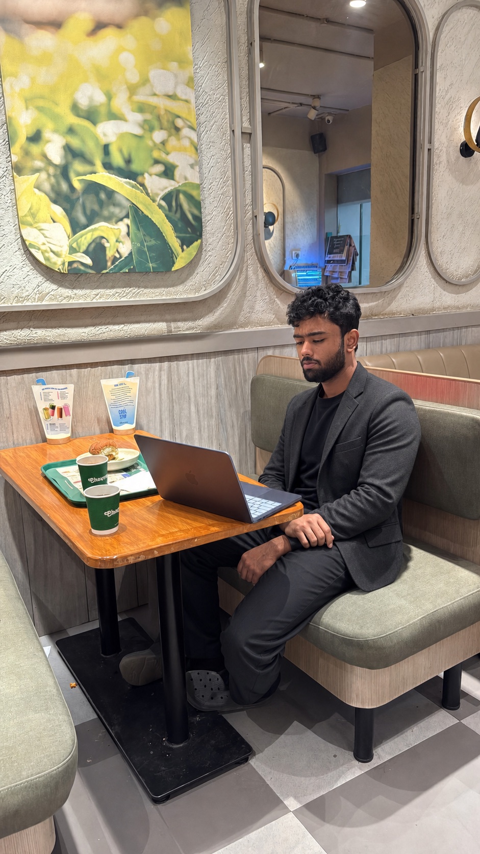 Sohan Vyaparee, founder and website creative director, working on a laptop