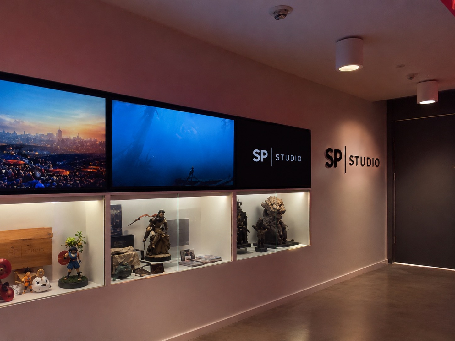 SP Studios creative space with studio signage, display cases and cinematic screens