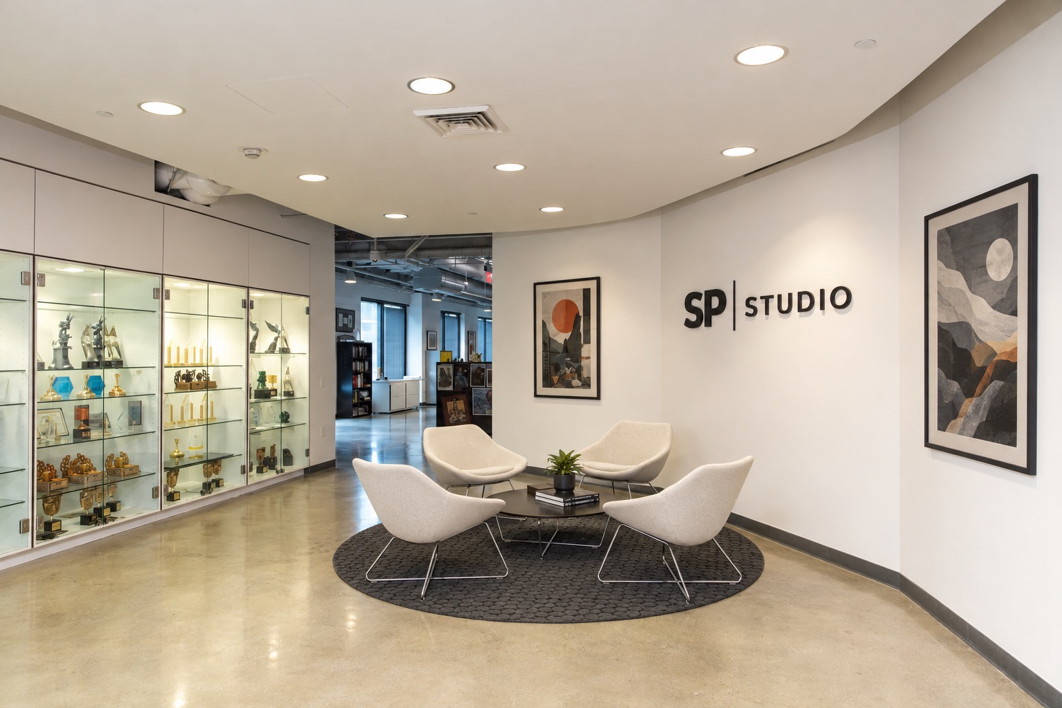 SP Studios meeting space with studio signage, artwork and seating